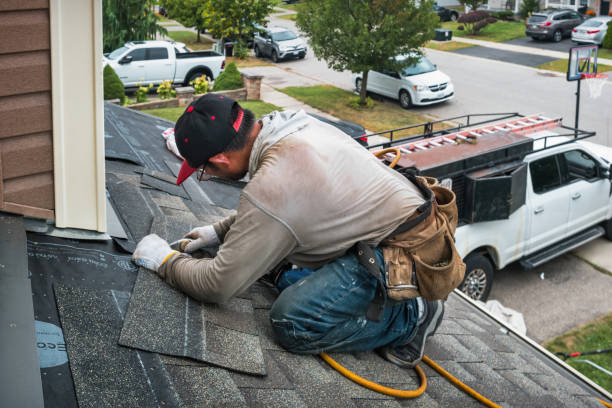 Professional Roofing technician working in Clovis, CA